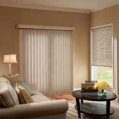 Lounge room setting with translucent vertical blinds in closed position allow soft light to enter room whilst providing complete privacy.