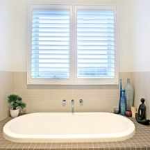 Bathroom fitted with white designer PVC Plantation Shutters Located in Melbourne 3000
