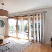 Vertical Blinds Block Out in open position over sliding doors in dining room