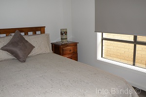 Bedroom setting installed with Blockout Roller Blinds in Melbourne Victoria 3000