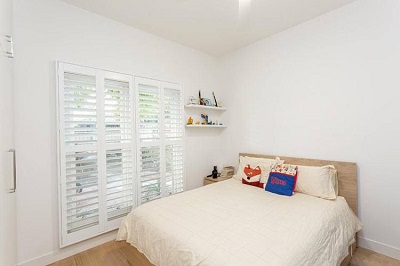 These plantation shutters are fitted to a bedroom window in Melbourne Victoria